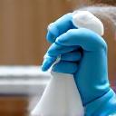 Disinfectant spray on an office surface